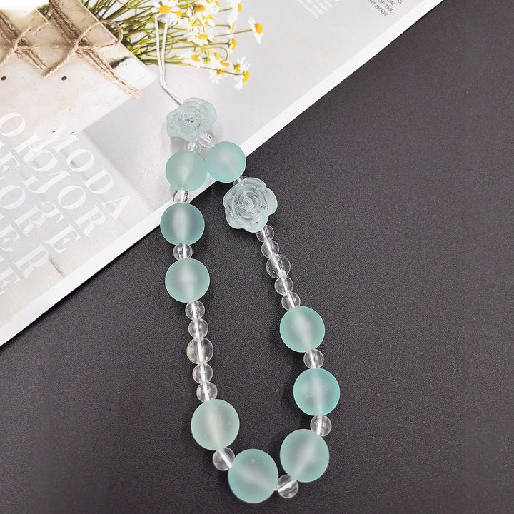 Sophisticated women's jewelry: beaded floral necklace featuring elegant light blue & green designs.
