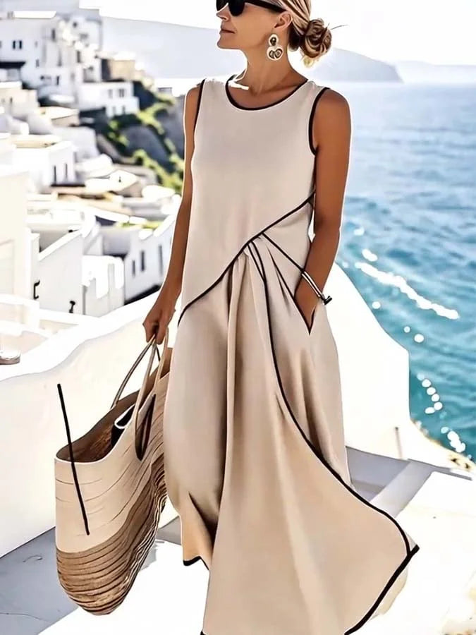 Versatile women's beige sleeveless maxi dress, relaxed & elegant, ideal for summer casual or dressed-up occasions.