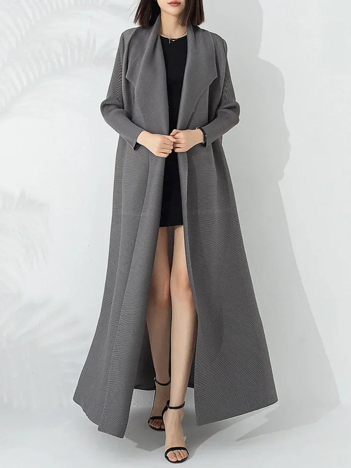 Fashionable women's long A-line coat featuring a flattering belt and a cozy funnel neck design.