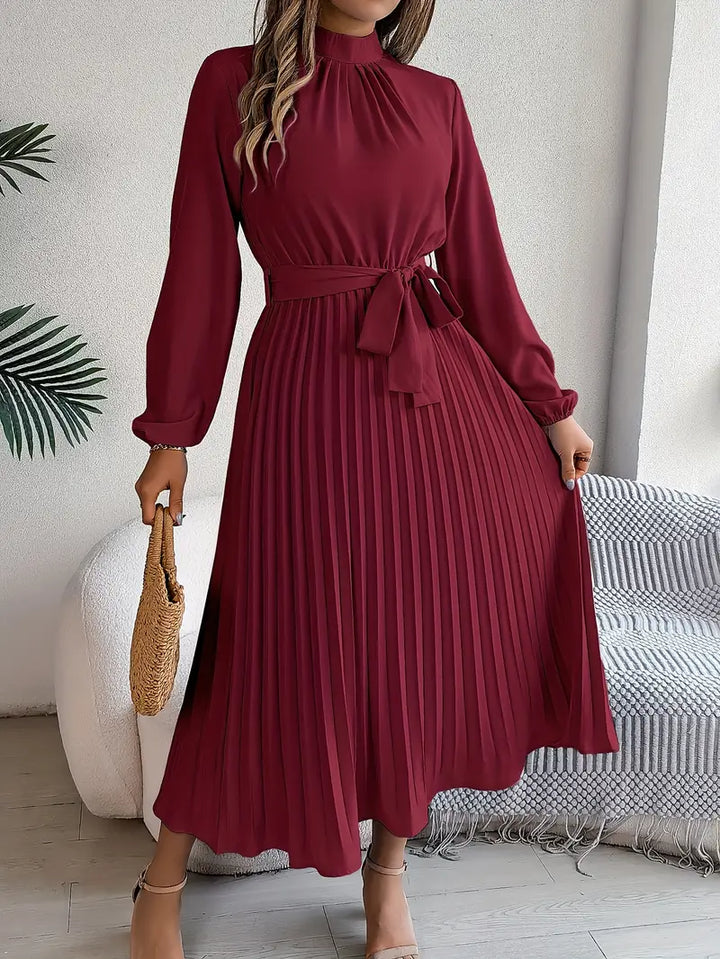 Chic women's elegant belted long-sleeve midi dress with a flattering pleated skirt, perfect for formal events.