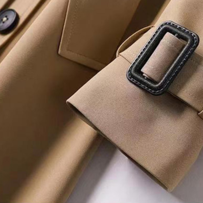 Elegant women's outerwear: belted trench coat, versatile and fashionable for all seasons.