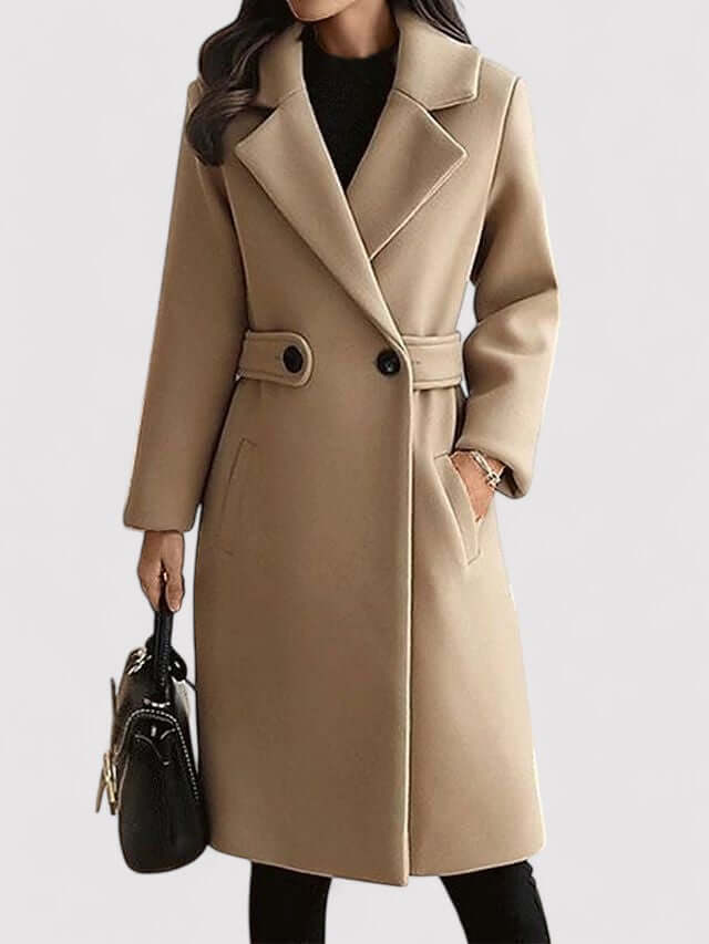 Elegant women's belted winter coat in a classic style, offering warmth and a flattering fit for cold weather.