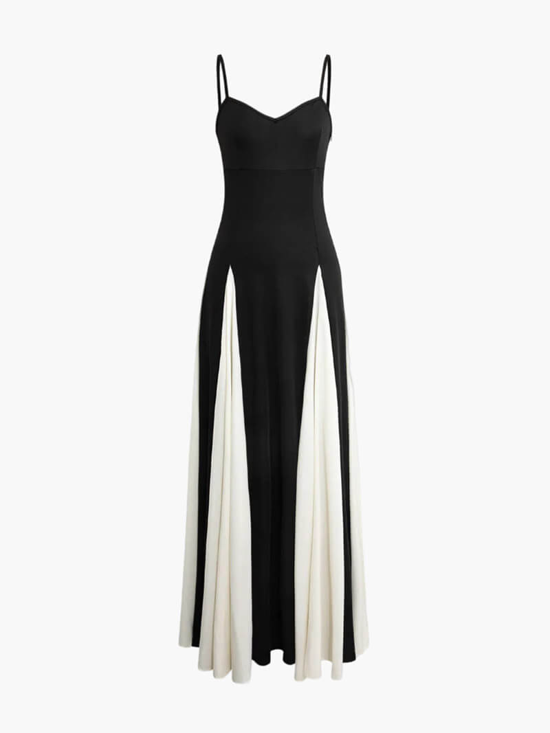 Sophisticated flowing black & white contrast maxi dress with an asymmetrical design for elegant party wear.