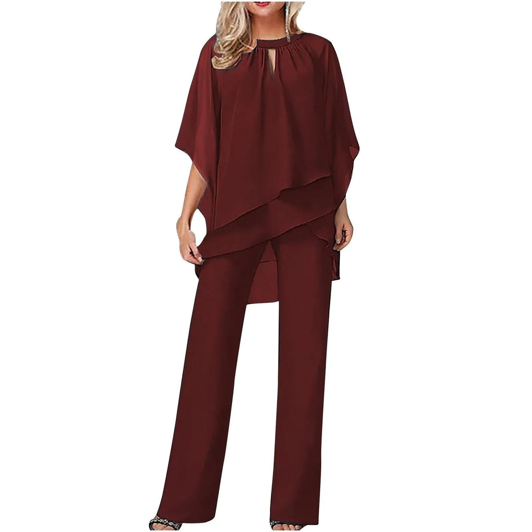 Stylish women's formal pantsuit featuring chic batwing sleeves & flowing wide leg, a sophisticated set.