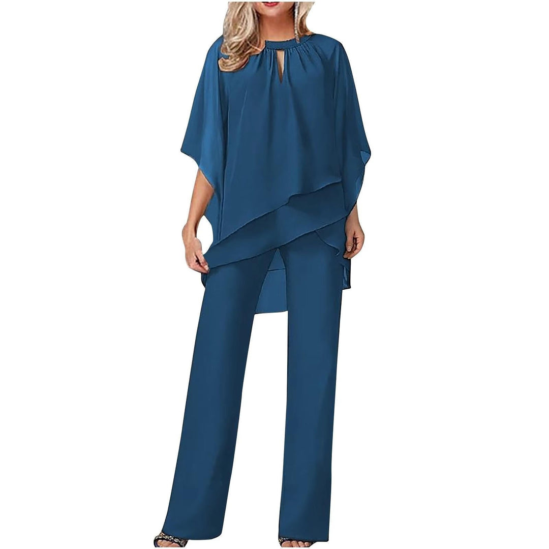 Elegant women's formal pantsuit with a flowing overlay, batwing sleeves & wide leg trousers for evening events.