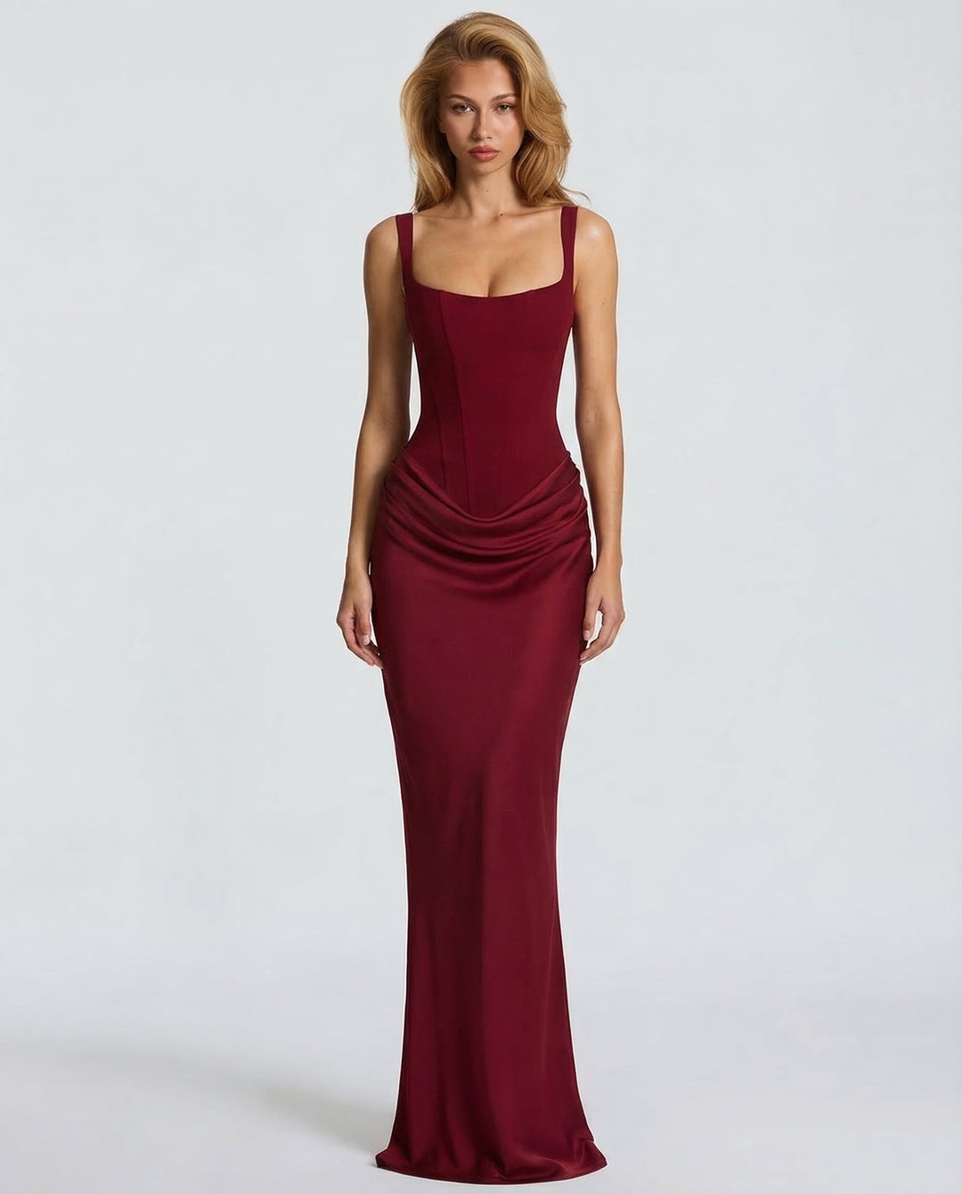 Chic women's formal corset maxi dress, featuring a sculpted silhouette and draped waist, ideal for an elegant party look.