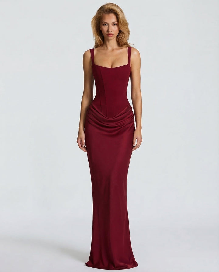 Chic women's formal corset maxi dress, featuring a sculpted silhouette and draped waist, ideal for an elegant party look.