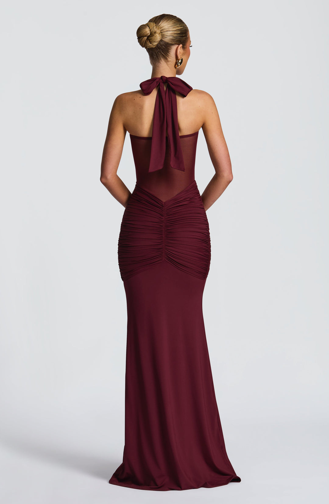 Stunning red halter neck maxi dress with ruched waist, elegant mesh detail. Perfect party or formal evening wear.