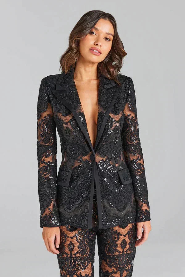 Women's statement white lace co-ord: sheer blazer, flared trousers, sequin embellishments for parties.