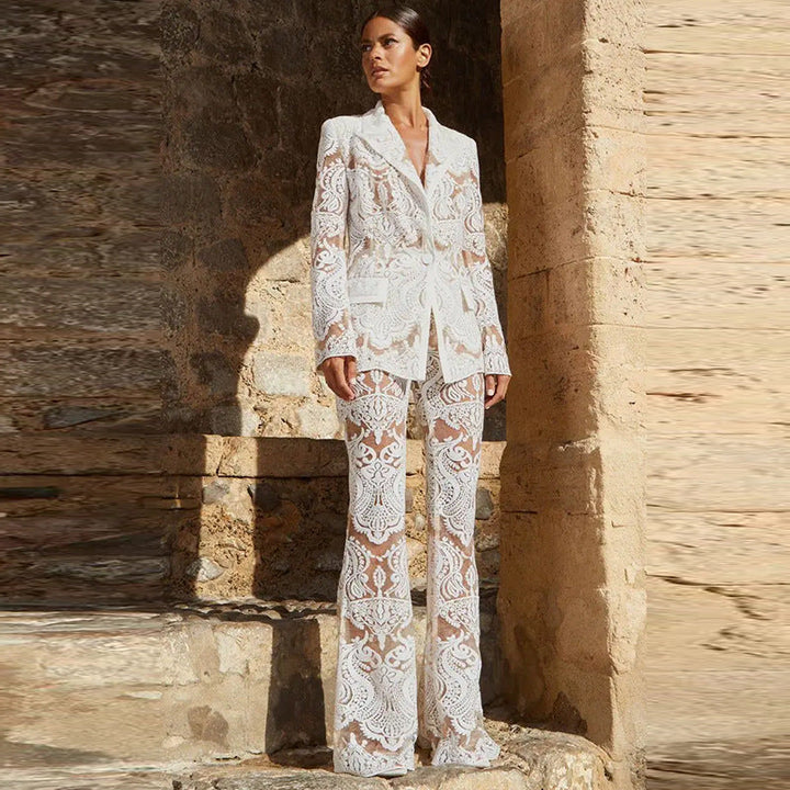 Striking women's black lace co-ord set, featuring a sheer blazer and flared trousers for special occasions.