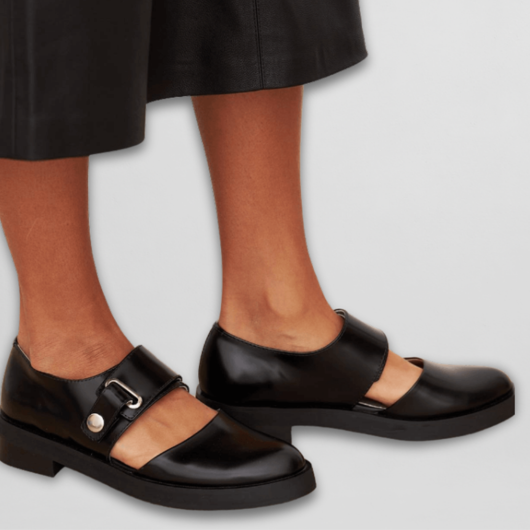 Elegant women's black low heel strap shoes with classic buckle for comfortable office wear or formal events.
