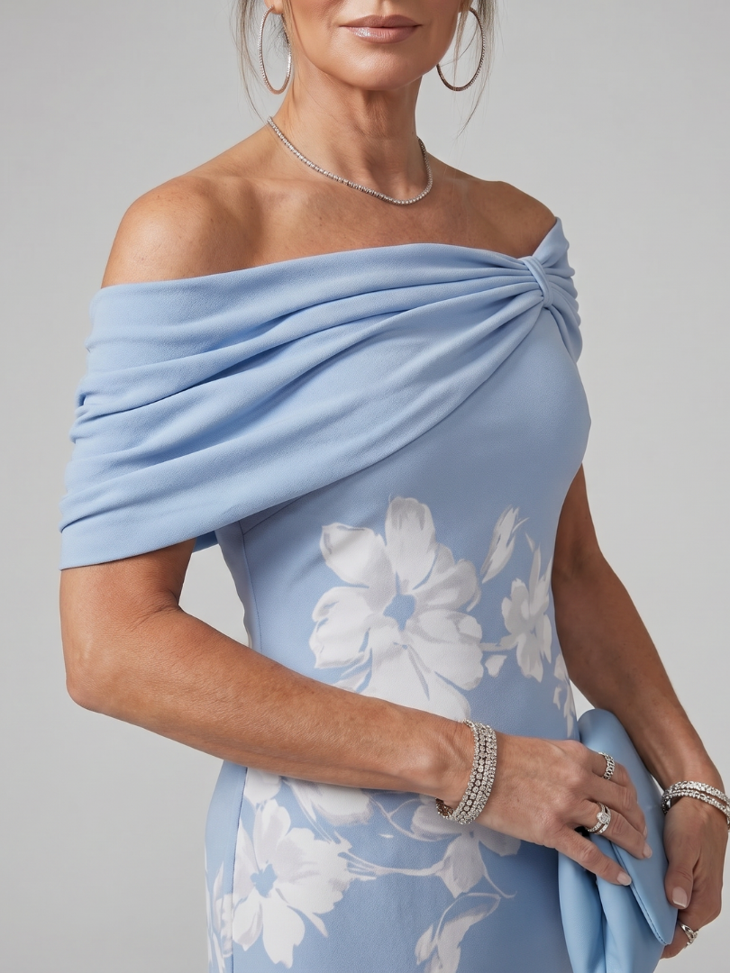 Formal women's blue off-shoulder draped midi dress, an elegant eveningwear option.