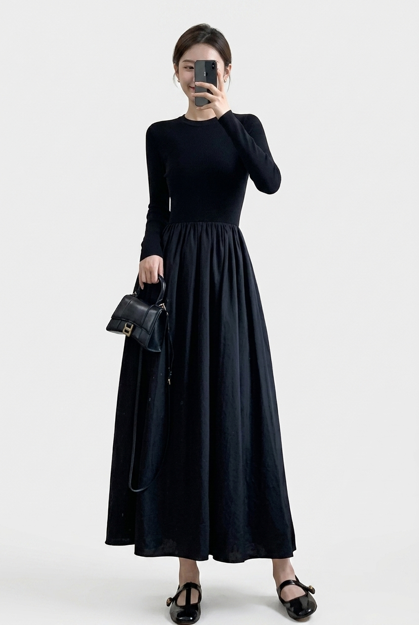 Elegant women's black two-piece set featuring a high neck long sleeve top and a flowing midi skirt, perfect for versatile wear.
