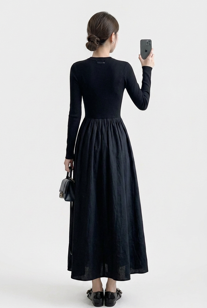 Textured black high neck long sleeve top and matching flowing midi skirt set for women, offering an elegant & comfortable fit.