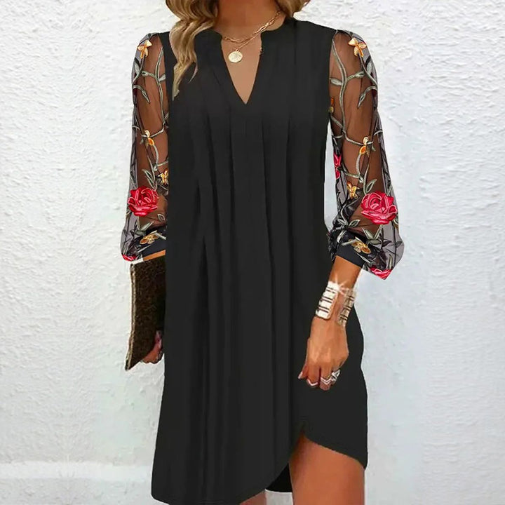 Elegant women's black V-neck dress with sophisticated floral lace sleeves, perfect for formal events & parties.