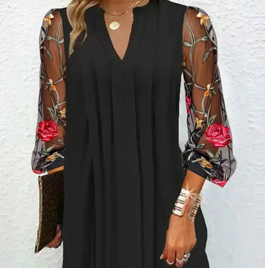 Sophisticated women's evening gown, black V-neck design with delicate floral sleeves for special occasions.