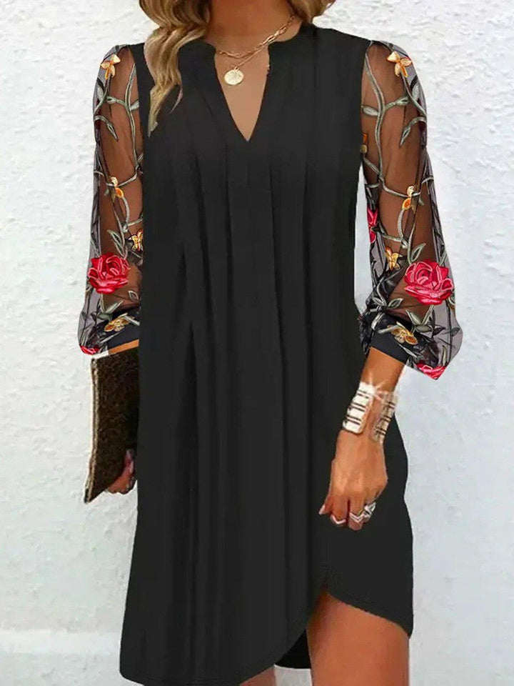 Women's formal black V-neck dress with elegant sheer floral sleeves, suitable for special occasion parties.