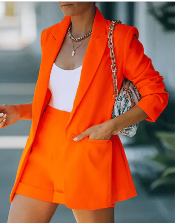 Elegant women's blazer and short matching set, ideal for stylish business casual or chic summer fashion.