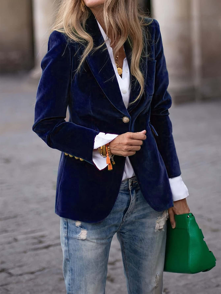 Sophisticated women's blazer featuring chic gold buttons, a versatile piece for modern fashion.