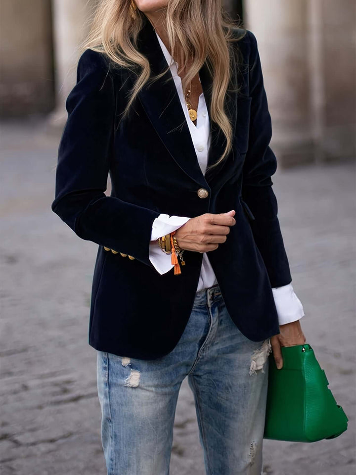 Sleek women's blazer with striking gold buttons, offering an elegant and stylish outerwear option.