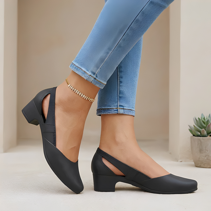 Stylish women's pumps featuring chic cutout details & a stable block heel. Versatile pointed toe slip-ons for dress or casual.