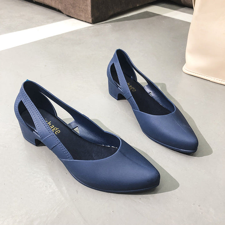 Sophisticated women's pumps with a comfortable block heel, pointed toe, & elegant cutout details. Ideal office & evening shoes.