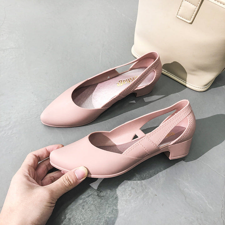 Chic women's slip-on pumps featuring a stylish block heel, pointed toe, & elegant cutout details. Fashionable dress footwear.
