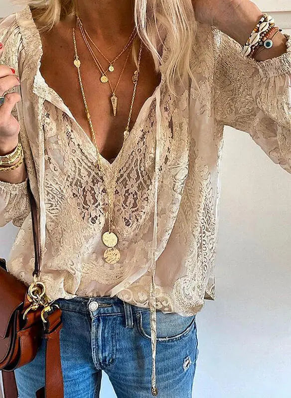 Stylish women's blouse, elegant boho design, featuring a trendy cutout neckline & flowy long sleeves.