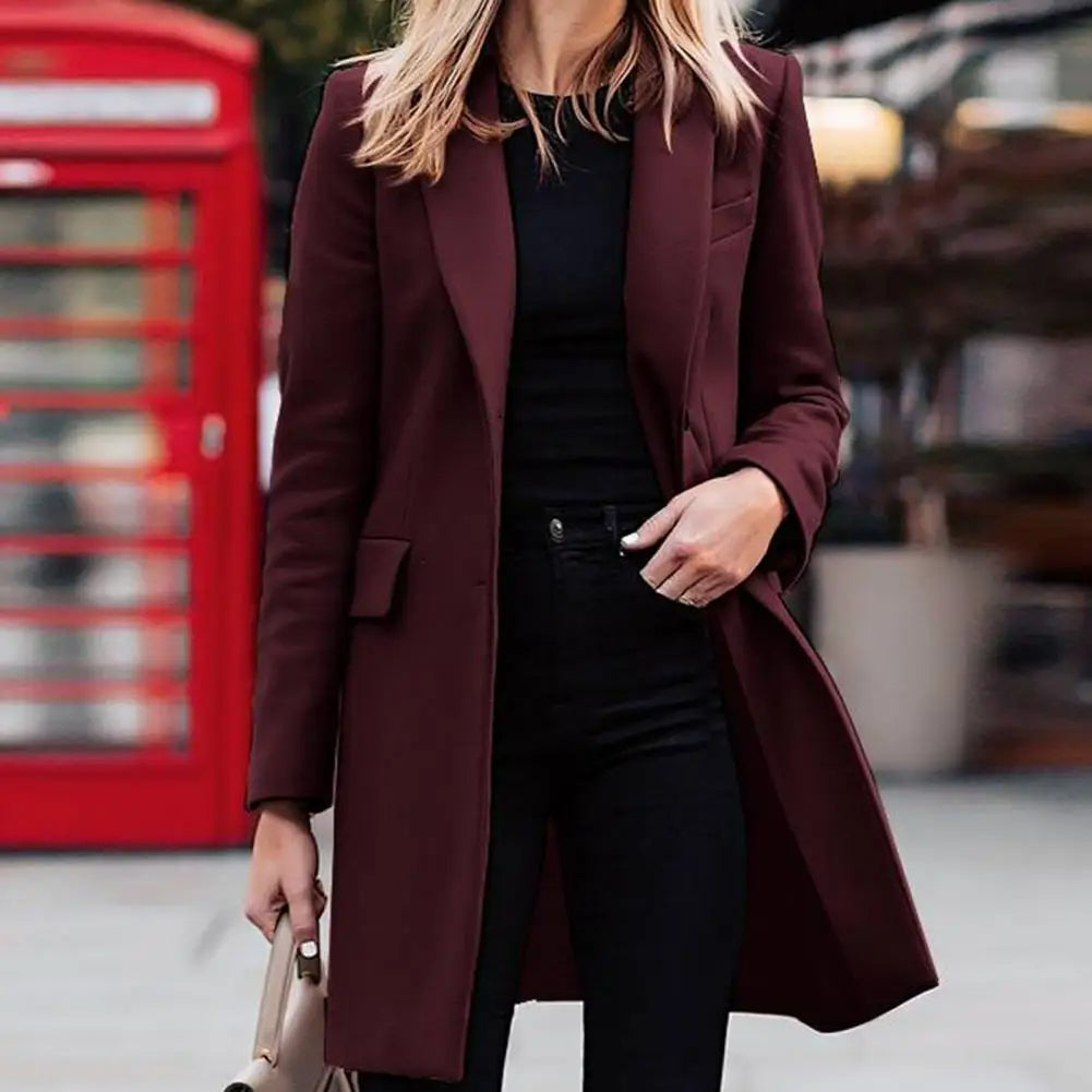 Elegant women's boho trench coat for winter. Long, cozy outerwear perfect for fall fashion.