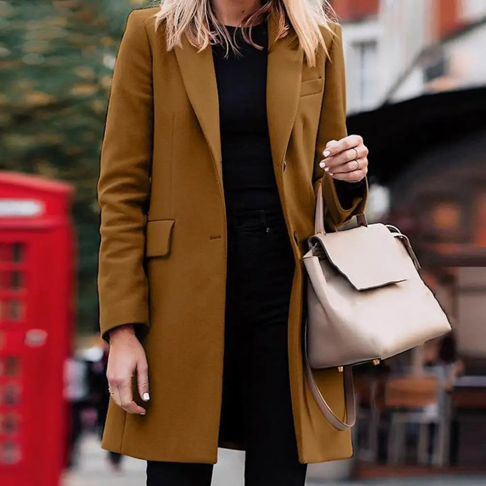 Cozy women's winter trench coat in elegant boho style. Long, double-breasted outerwear for cold weather.
