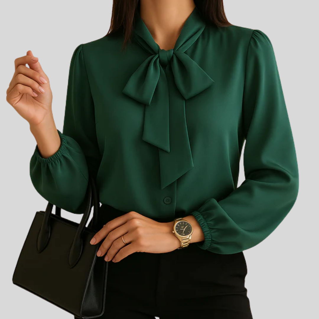 Elegant women's bow-detail blouse, perfect for versatile workwear or sophisticated casual outfits. Long cuffed sleeves.