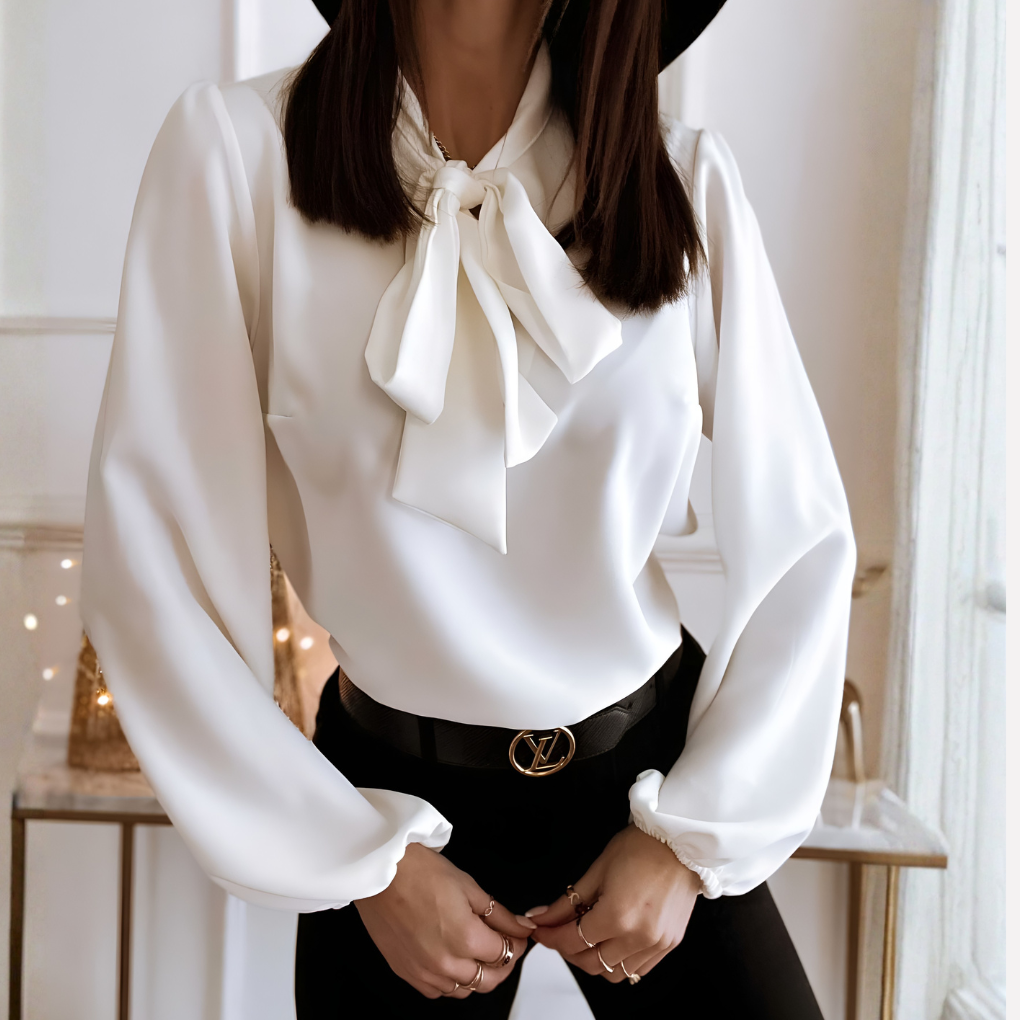 Sophisticated women's elegant bow-detail shirt with cuffed long sleeves. A fashionable top for work or everyday wear.