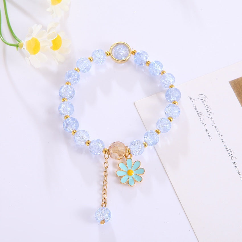 Beautifully crafted women's bracelet, showcasing a sparkling flower pendant & multiple glass beads.