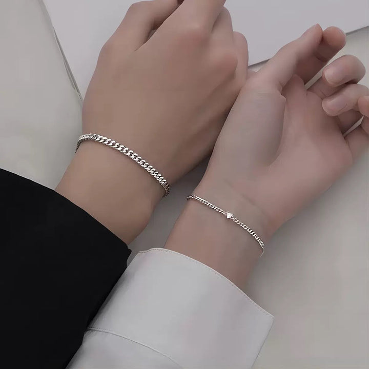 Delicate braided chain bracelet for women, elegant silver and gold design, a perfect fashion accessory.