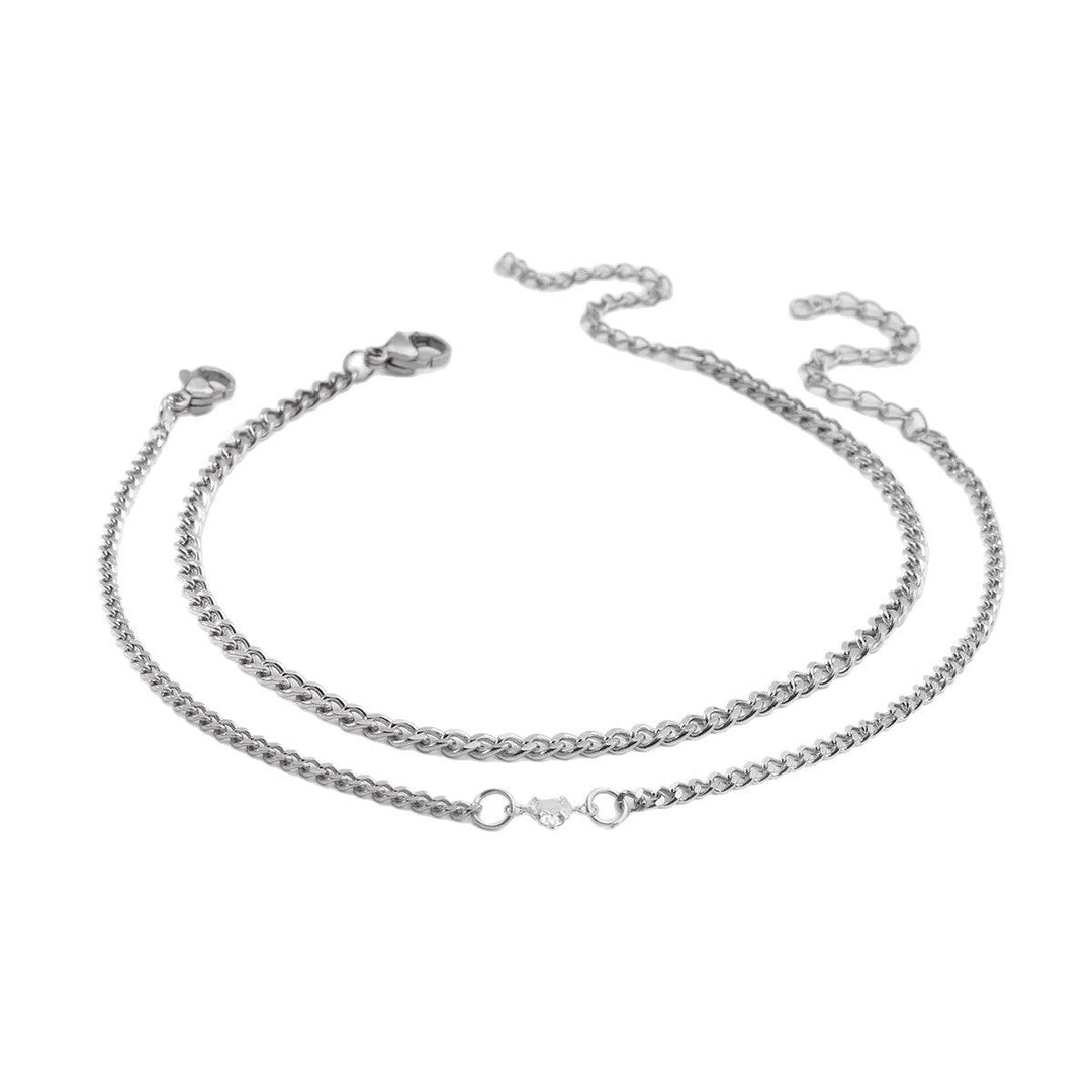 Elegant women's braided silver & gold chain bracelet, delicate design adds a touch of class.