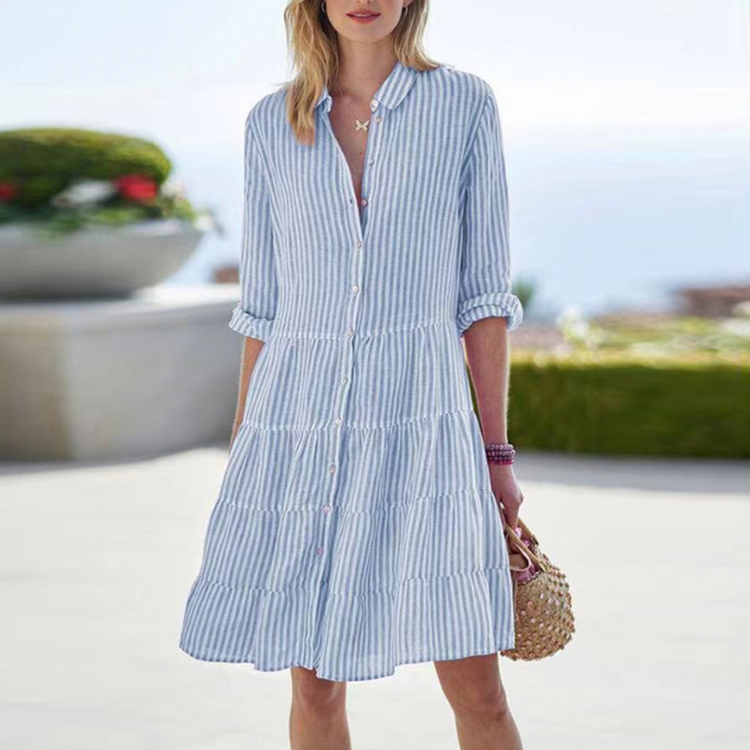 Elegant women's breezy summer dress, light and flowy, perfect for chic casual or party wear. Sleeveless design.