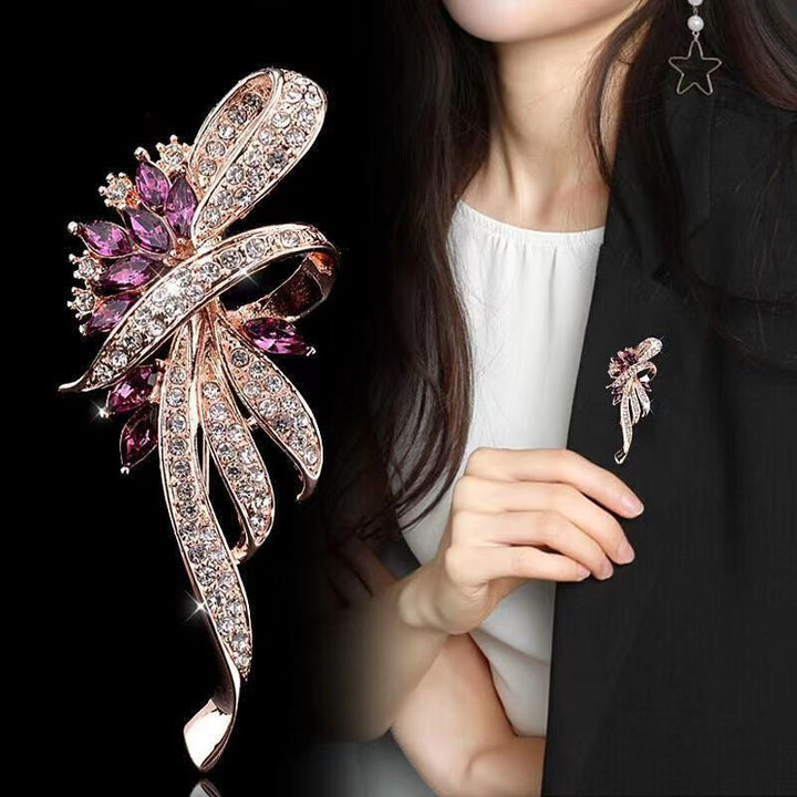Sparkling zirconia brooch featuring stunning blue gemstones, an elegant women's fashion accessory.
