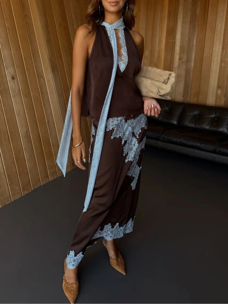 Flowing brown maxi skirt for women, featuring elegant lace panels, paired with a stylish V-neck halter top.