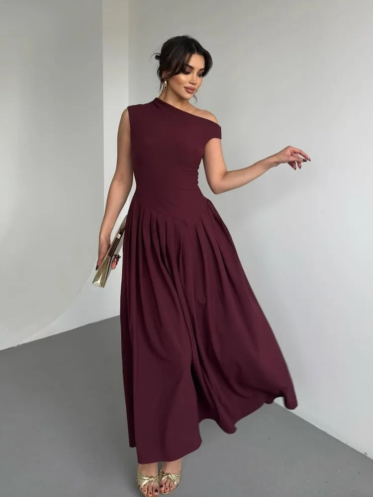 Fashionable women's burgundy draped one-shoulder maxi dress, an elegant choice for sophisticated special occasions.
