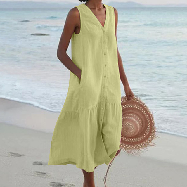 Woman wearing an elegant button-down V-neck midi summer dress, showcasing comfortable and versatile fashion.