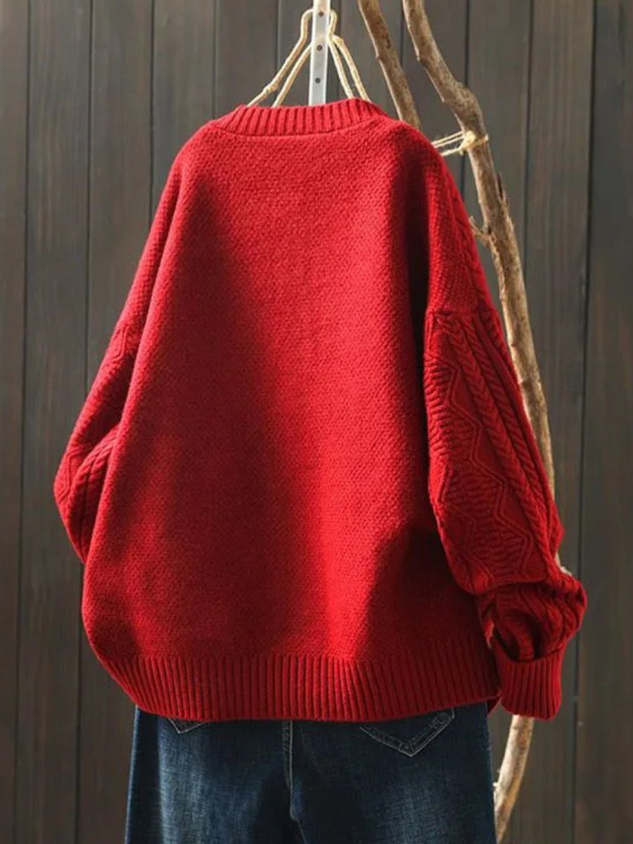 Versatile women's cable-knit button-down cardigan, an elegant layering piece for autumn fashion.