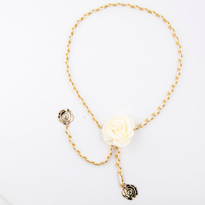 Full-length view of an elegant women's rose detail chain belt, a stylish and adjustable waist accessory.
