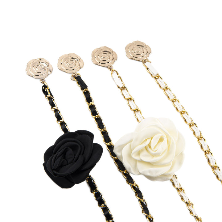 Chic women's black chain belt featuring elegant rose details, perfect as a dress or waist accessory.