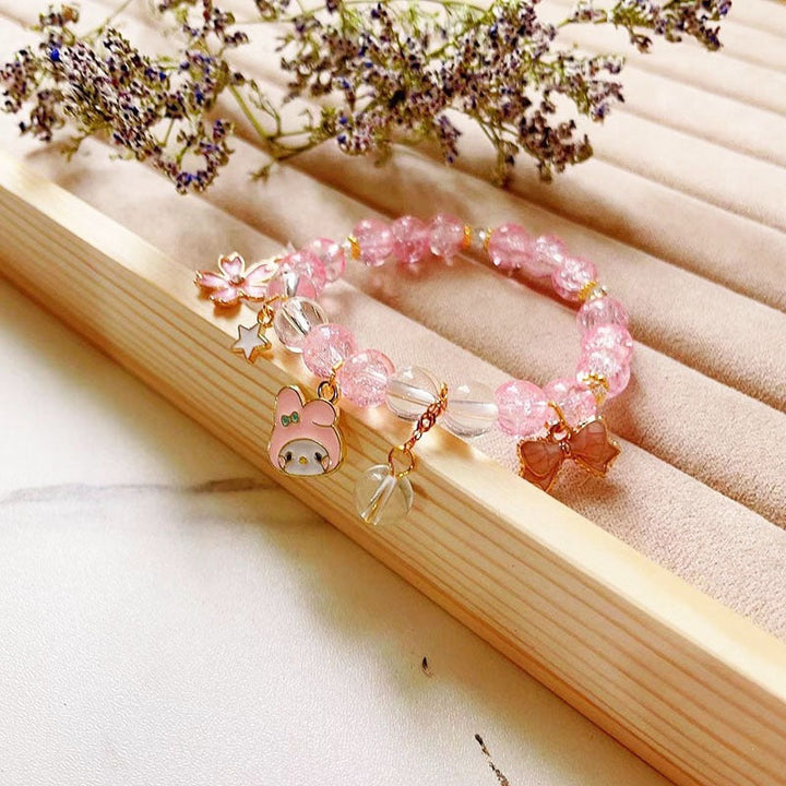 Fashion-forward women's bracelet with elegant animal and glitter charm details, a must-have.