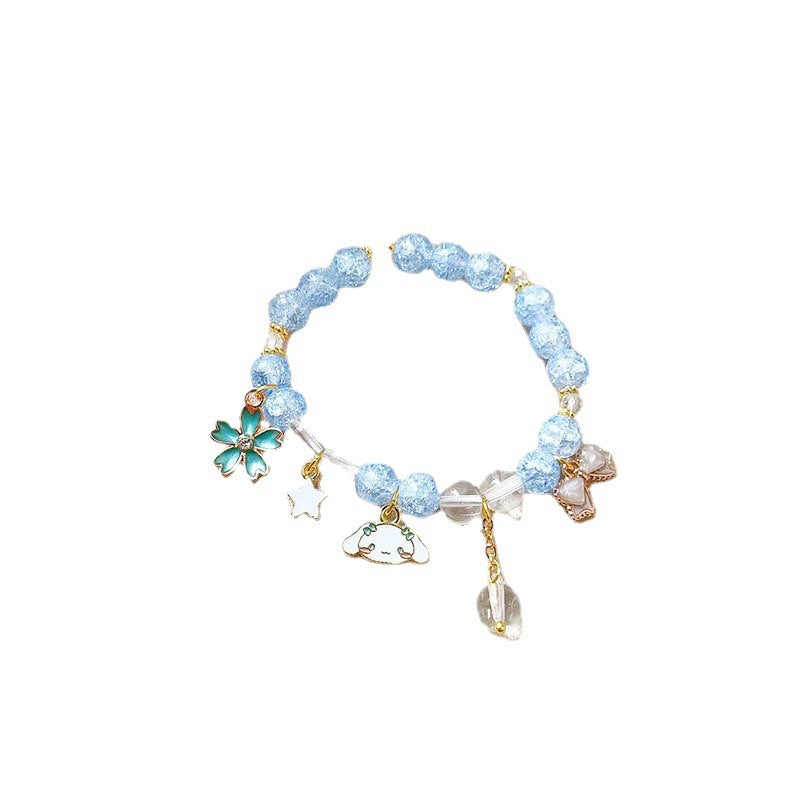 Gift for her: Elegant women's sparkling animal & glitter charm bracelet on wrist.
