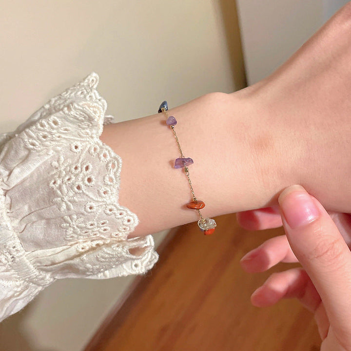 Finely crafted women's gemstone charm bracelet with vibrant stones, an adjustable fashion jewelry item.