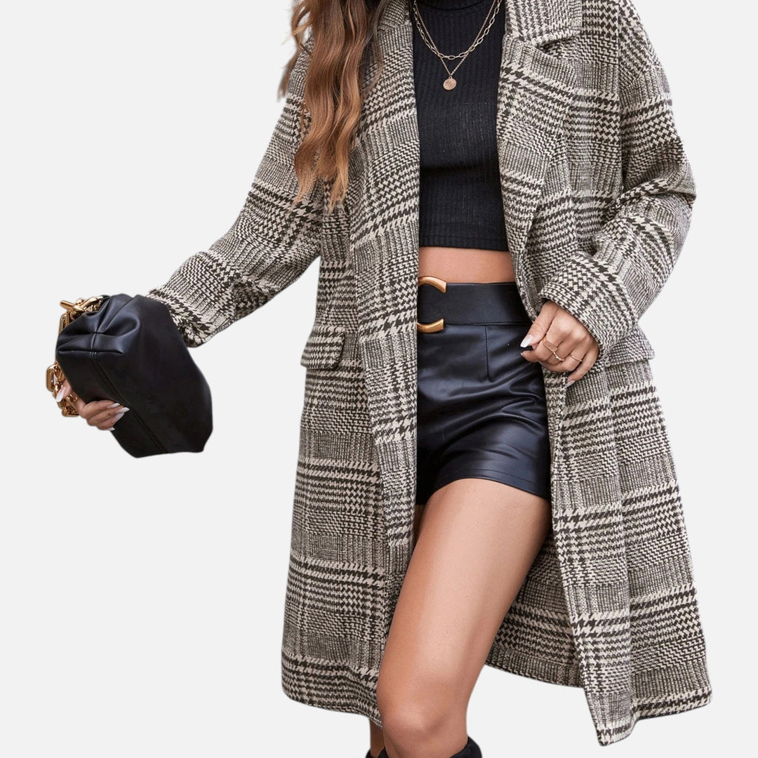 Women's tailored checkered blazer with lapel collar. Smart and elegant outerwear for autumn and spring fashion.