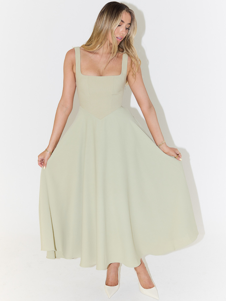 Chic women's midi dress featuring an elegant square neckline, versatile for wedding guest or cocktail parties.