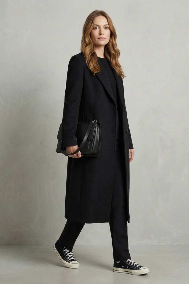 Women's tailored brown herringbone overcoat, perfect for elegant fall style and sophisticated outerwear.