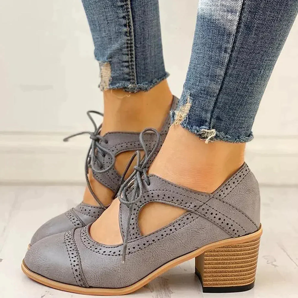 Elegant women's classic brogue heeled boots. Perfect for versatile fall & winter fashion.